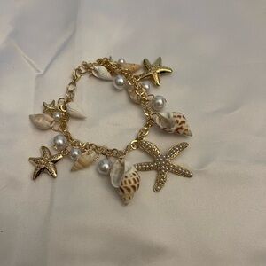 Gold Starfish and Shell Charm Bracelet